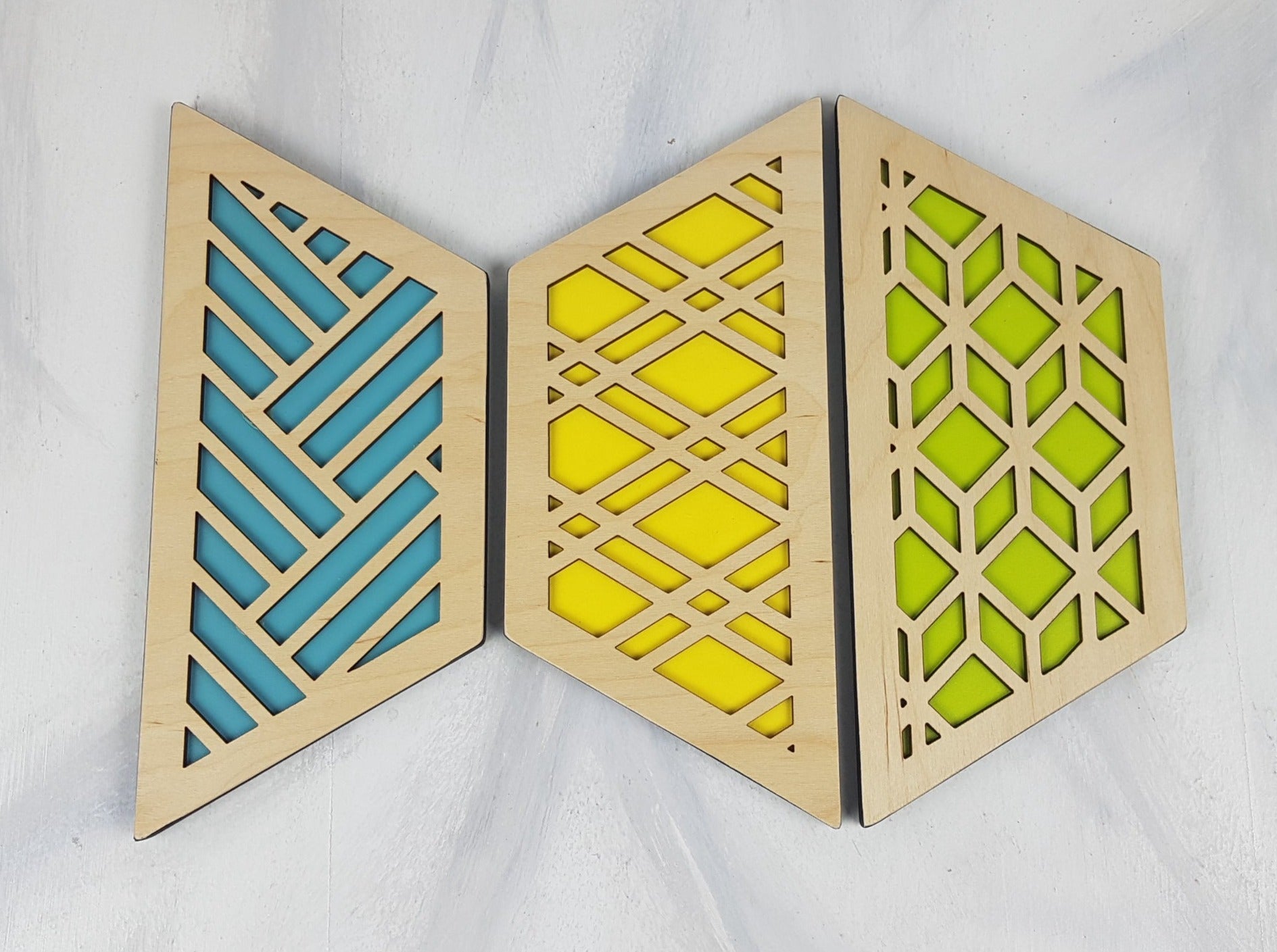 A close-up of one of the hexagonal trivets with a black stain finish. Handmade Heat Resistant Kitchen Accessories